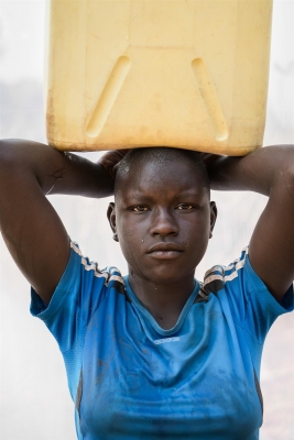 Dan Nelken: A. Sarah: Age 13. Carries a 5 gallon jerrycan of water (41lbs) home three times a day, from the series The Women of Rural Uganda, 2018 Dan Nelken: A. Sarah: Age 13. Carries a 5 gallon jerrycan of water (41lbs) home three times a day, from the series The Women of Rural Uganda, 2018